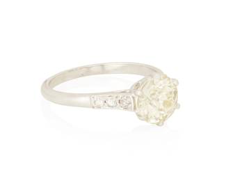 1080
An 18K White Gold and Diamond Ring
Centering an Old European-cut diamond weighing approximately 1.60 carats, accented by six round diamonds
Size: 6 3/4
3.34 grams gross
Center Diamond:
Approximate overall color and clarity: M-N, SI-I
Estimate: $1,500 - $2,500