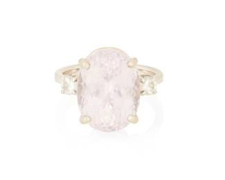 1079
A 14K White Gold, Kunzite and Diamond Ring
Centering an oval kunzite weighing approximately 12.25 carats, accented by round diamonds weighing approximately 0.34 carat
Size: 7 3/4
7.9 grams gross
Estimate: $1,000 - $2,000