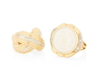 1072
Two 14K Gold and Diamond Rings
One centering a carved mother-of-pearl disc accented by round diamonds together with a ring of an "X" motif set with round diamonds weighing approximately 0.88 carat
2 pieces
Sizes: 4 3/4 and 5
24.9 grams gross
Estimate: $1,000 - $2,000