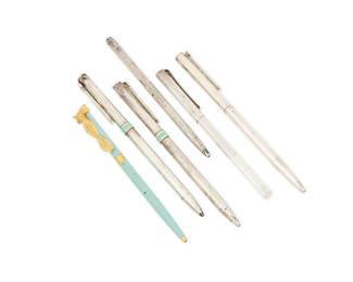 1170
Tiffany & Co.: A Group of Sterling Silver and Enamel Pens
Comprising five sterling silver pens including two with a blue enamel band and one with a textured surface, as well as a blue enamel pen with gold-tone metal accents, each marked for Tiffany & Co, and for sterling
6 pieces
Lengths: 5 1/4 in - 4 5/8 in.
111.2 grams gross
Estimate: $200 - $300