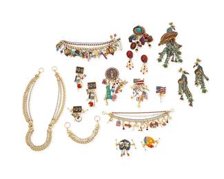 1162
A Large Group of "Lunch at the Ritz" Costume Jewelry
Featuring multiple sets of gold-toned and mixed metal jewelry with multicolored enamel and diamanté accents, all in various themes including a set of "Vote USA" pendant/brooch, two earrings and a chain link charm bracelet, a Hanukkah-themed charm bracelet, a pair of "Teacher" schoolroom motif earrings and a toggle, a "Peacock" pendant brooch with matching earrings, a "Hats" themed pendant brooch with matching earrings, and four various decorative chains and toggles
18 pieces
Chains: 19 in. & 5 1/2 in.; Bracelets: 7 1/2 - 7 in.; Earrings: 4 1/4 in. - 2 in.; Brooches: 6 in. - 3 1/2 in.
440.5 grams gross
Estimate: $200 - $400