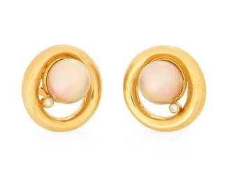 1032
A Pair of 18k Gold, Cultured Pearl and Diamond Earrings
Of an organic round design featuring two cultured pearls measuring approximately 13.13 mm, accented by two round diamonds
2 pieces
Measures: 1 x 1 in.
28.7 grams gross
Estimate: $1,500 - $2,500
