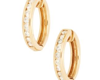1101
A Pair of 14K Gold and Diamond Hoop Earrings
Featuring nine round diamonds on each earring weighing approximately 0.45 carats each
2 pieces
Measures: 7/8 in.
8.2 grams gross
Estimate: $600 - $800