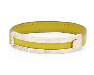 1146
Hermès: A Vintage Chevre Mysore Pousse Bracelet, 2001
A Vert Anis green goatskin leather bangle bracelet with silver-toned metal adjustable buckle accent, stamped for Hermes and for date verso
Inner circumference: 8 1/2 - 6 1/2 in.
11 1/2 grams gross
Estimate: $300 - $500