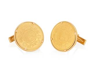 1120
A Pair of Gold Coin Cufflinks
Featuring 20k gold Saudi Arabia Gold One Guinea coins, set in a 14k gold frame
2 pieces
Measures: 7/8 x 7/8 in.
23.1 grams gross
Estimate: $800 - $1,200