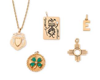 1111
A Group of Gold and Gem-Set Pendants
Including four 14k gold pendants, one suspended from a 14k gold chain, together with an 18k gold Gucci Italy "E" pendant
5 pieces
Measures: 3/4, 1 1/4, 1 5/8 in., chain: 18 in.
39.4 grams gross
Estimate: $1,500 - $2,500