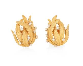 1086
A Pair of 18K Gold, Platinum and Diamond Earrings
Featuring a feathered design set with round diamonds weighing approximately 0.72 carat
2 pieces
Measures: 1 x 3/4 in.
12.67 grams gross
Estimate: $300 - $500