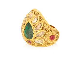 1096
A Mughal Style Gold and Gem-Set Ring
Of a foliate design featuring diamond slices accented and centering foil backed beryl cabochons
Size: 12
24.8 grams gross
Estimate: $1,000 - $2,000