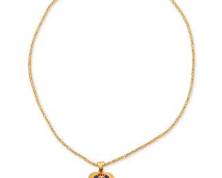 1055
A Gold and Enamel Pendant Necklace
Featuring an 18k gold fancy link chain suspending a 20k gold scarab Egyptian style pendant accented by red and blue enamel
Pendant: 1 x 3/4 in., Chain: 16 1/2 in.
20.4 grams gross
Estimate: $800 - $1,200