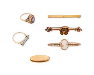 1124
A Group of Gold, Gem-Set and Diamond Jewelry
Including 3 bar pins, 1 tie clip and 2 rings featuring amethyst, rose-cut diamonds and a carved shell cameo
6 pieces
Rings: 5 and 7, Pins: 1 1/8- 2 1/4 in.
23.3 grams gross
Estimate: $1,000 - $2,000