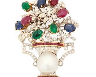 1058
An 18K Bi-Color Gold, Gem-Set and Diamond Brooch
Of a flower bouquet design set in a cultured pearl vase accented by oval ruby, emerald and sapphire cabochons finished with round diamonds and square-cut rubies
Measures: 1 7/8 x 1 1/2 in.
29.4 grams gross
Estimate: $1,000 - $2,000