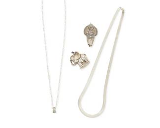 1185
A Group of Sterling Silver Jewelry
Comprising two repoussé sterling silver hollow silver pendants, one an elephant, and one an angel, together with two sterlong silver chains, one a flat snake chain, and one a narrow paper clip chain, one marked for sterling
4 pieces
Pendants: 2 3/4 in. & 2 in. H ; Chains: 29 in. & 25 in. L
55.6 grams
Estimate: $300 - $500