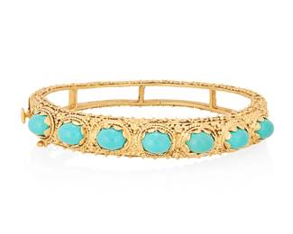 1066
A Gold and Turquoise Bracelet
Of a hinged design featuring seven oval turquoise cabochons set in a scrolling motif
Inner circumference: 6 1/2 in.
29.5 grams gross
Estimate: $400 - $600