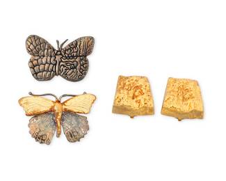 1169
A Group of Silver and Vermeil Jewelry
Including a pair of Mignon Faget gold vermeil earclips together with two silver butterfly pins with makers' marks
3 pieces
Earrings: 7/8 in., Brooches: 1 1/2 and 1 5/8 in.
41.2 grams gross
Estimate: $300 - $500