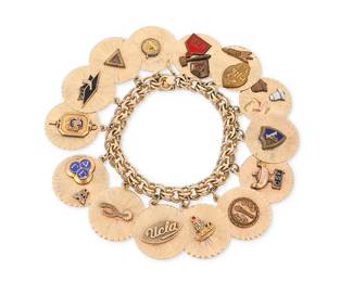 1004
A 14K Gold Charm Bracelet
Featuring fourteen round charms honoring UCLA and university clubs
Length:7 1/2 in.
81.2 grams gross
Estimate: $2,500 - $3,500