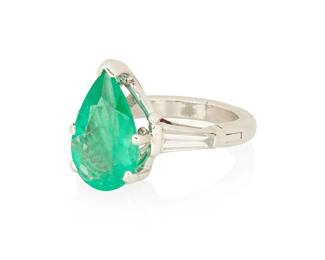 1084
An 18K White Gold, Emerald and Diamond Ring
Centering a pear-shaped emerald weighing approximately 2.90 carats, flanked by two tapered baguette diamonds
Size: 4 1/4 with arthritic shank
6.0 grams gross
Estimate: $1,500 - $2,500