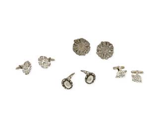 1171
A Group of Silver Cufflinks including Georg Jensen
Comprising three pairs of sterling silver cufflinks in various designs, two marked for Denmark, one for Georg Jensen, as well as a large pair of modernist-style silver sunburst cufflinks
8 pieces
Largest: 1 in.; Smallest: 1/2 in.
44.6 grams gross
Estimate: $300 - $500