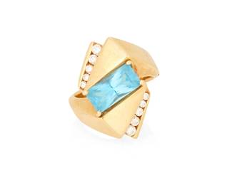 1040
A 14K Gold, Blue Topaz and Diamond Ring
Centering a modified rectangular-cut blue topaz weighing approximately 2.60 carats accented by ten round diamonds
Size: 7
9.1 grams gross
Estimate: $800 - $1,200