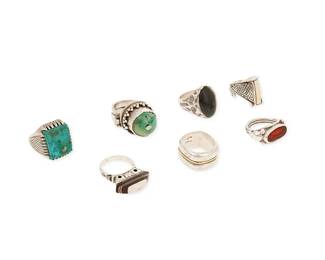 1186
A Group of Sterling Silver and Set Stone Rings
Comprising seven rings in various designs and sizes including a North African ring with domed turquoise, a square turquoise ring, a Celtic-style ring with carved bone, a modernist-style ring with a dark set nephrite jade caboon, a carnelian intaglio ring with engraved Arabic characters, a trapezoid ring with wood inlay, and a chunky sterling band with a 18K gold accent line, four marked for sterling
7 pieces
Rings: sizes 11 1/2 to 9
110.2 grams gross
Estimate: $700 - $900