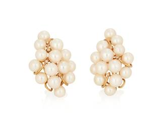 1034
A Pair of 14K Gold and Cultured Pearl Earrings
In a cluster motif featuring cultured pearls measuring approximately 5.4-5.8 mm
2 pieces
Measures: 1 1/4 x 7/8 in.
111.8 grams gross
Estimate: $400 - $600