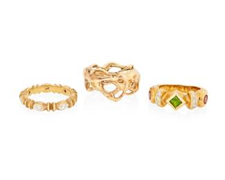 1109
A Group of 14K Gold and Gem-Set Rings
Including an organic design, a textured band accented by round diamonds and one centering a green diopside flanked by two pink tourmalines
3 pieces
Sizes: 6, 6 1/4 and 7
21.2 grams gross
Estimate: $800 - $1,200