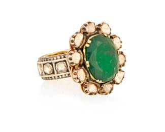 1098
A Mughal Style Gold and Diamond Ring
Centering an oval beryl measuring approximately 17.97 x 14.34 mm, accented by diamond slices
Size: 7 3/4
22.9 grams gross
Estimate: $1,500 - $2,500