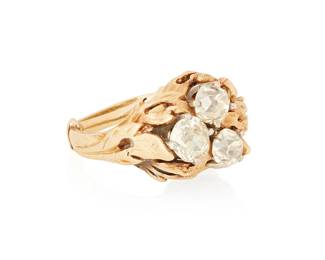 1076
A 14K Gold and Diamond Ring
Centering three old Mine-cut diamonds weighing approximately 1.50 carats set in a foliate design mount
Size: 4 1/2
7.7 grams gross
Estimate: $400 - $600
