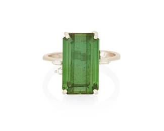 1059
An 18K White Gold, Green Tourmaline and Diamond Ring
Centering a rectangular step-cut green tourmaline weighing approximately 7.20 carats, accented by four round and baguette diamonds
Size: 7 1/4
5.6 grams gross
Estimate: $300 - $500