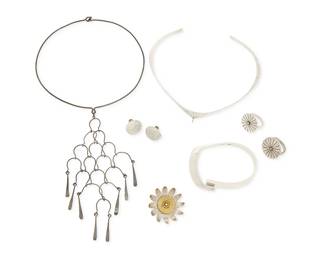 1179
A Group of Sterling Silver Modernist-style Jewelry
Comprising a Betty Cooke sterling silver torque collar necklace, a silver wire collar necklace with interlocking wire pendant, as well as a Hayner sterling silver oval bangle with tension clasp, a mixed metal floral brooch, two sterling silver starburst-style rings , and a pair of hammered silver earrings
8 pieces
Necklaces: 14 in. inner C x 5 1/4 in. and 11 1/2 in. L; Bangle: 6 1/2 in. inner C; Brooch: 1 1/2 in. Dia.; Rings: size 6 1/4; Earrings: 5/8 in. Dia.
67.3 grams gross
Estimate: $400 - $600