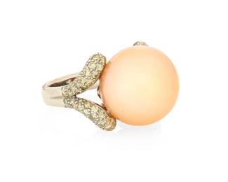 1024
An 18K White Gold, Cultured Pearl and Colored Diamond Ring
Centering a large peach cultured pearl measuring approximately 16.9 mm, accented by round green diamonds
Size: 6 3/4
15.7 grams gross
Estimate: $1,200 - $1,800