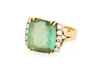 1074
A 18K Gold, Green Tourmaline and Diamond Ring
Centering a rectangular mixed-cut green tourmaline weighing approximately 9.50 carats, accented by ten round diamonds weighing approximately 0.40 carat
Size: 7 1/4
7.8 grams gross
Estimate: $1,000 - $2,000