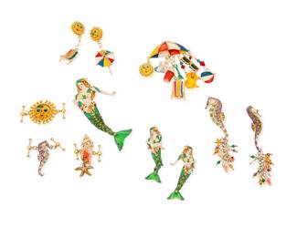 1158
A Group of "Lunch at the Ritz" Costume Jewelry
Featuring sea and beach-themed mixed metal and multicolored enamel jewelry, including mermaids, seahorses, shells, beach chairs and toys, with two brooch pendants, each with a pair of matching earrings, and three toggle link charms
11 pieces
Largest brooch: 4 1/2 in H; Smallest toggle: 1 3/8 in. H
145.7 grams gross
Estimate: $100 - $200
