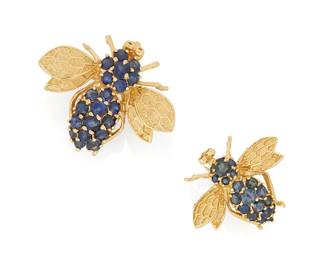 1119
Two 14K Gold and Sapphire Pendant/Brooches
Of a larger and smaller bee design featuring round sapphires and textured gold wings
2 pieces
Measures: 1in, 3/4 in.
10.7 grams gross
Estimate: $600 - $800