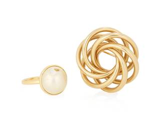 1046
Tiffany & Co.: A Gold Brooch and Ring
Including an 18k Paloma Picasso for Tiffany mabe pearl ring together with a 14k gold Tiffany & Co interwoven wreath style brooch
2 pieces
Measures: 1 1/8 in, Ring Size: 6 3/4
12.3 grams gross
Estimate: $700 - $900
