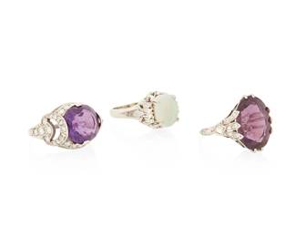 1045
A Group of Three Platinum and Gem-Set Rings
Including one set with an oval amethyst accented by rose-cut diamonds, a round amethyst accented by single-cut and rose-cut diamonds, and one centering an oval opal cabochon finished with round diamonds
3 pieces
Sizes: 5 1/2, 5 1/2 and 5 3/4
16.7 grams gross
Estimate: $800 - $1,200