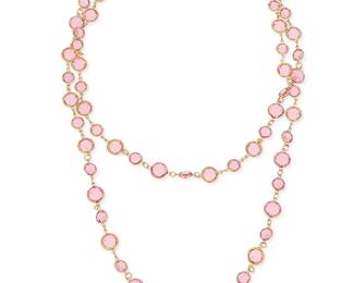 1154
CHANEL: A Gold Tone and Baby Pink Glass Necklace, 1981
Designed as a delicate long chain featuring alternating large and small round pale pink glass links, signed on charm: Chanel, double C, 1981
Length: 50 in.
57.8 grams gross
Estimate: $600 - $800