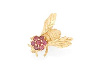 1105
A 14K Gold and Ruby Pin
Of a bee design accented by seven round rubies
measures: 3/4 x 3/4 in.
3.8 grams gross
Estimate: $300 - $500