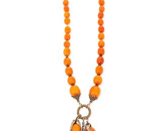 1167
A Silver and Amber Necklace
A late 19th century Chinese graduated oval butterscotch amber bead necklace suspending three large amber bead drop pendants mounted to gold-washed silver leaves
Length: 28 1/2 in. x 4 in.
122.4 grams gross
Estimate: $800 - $1,200
