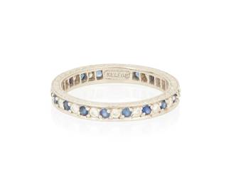 1082
Jack Kelege: A Platinum, Sapphire and Diamond Eternity Band
Featuring round alternating round sapphires and diamonds finished with a floral etched design, signed Kelege
Size: 6 1/4
3.4 grams gross
Estimate: $400 - $600