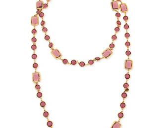 1153
CHANEL: A Gold Tone and Purple Glass "Chicklet" Necklace, 1981
Designed as a long chain featuring round and rectangular amethyst colored glass links, signed on charm: Chanel, double C, 1981
Length: 57 in.
166.2 grams gross
Estimate: $1,500 - $2,000