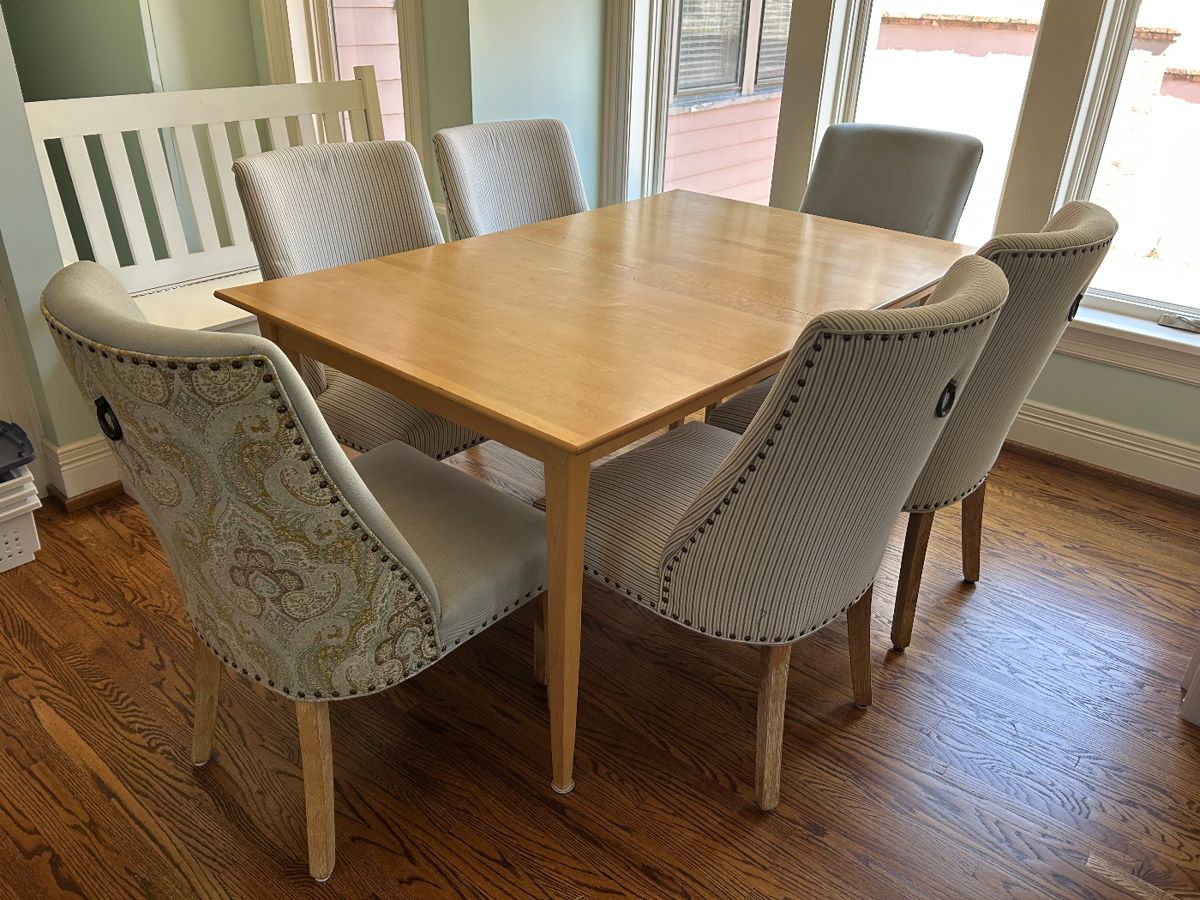 Blond wood kitchen table with one leaf and 6 upholstered chairs sold separately 