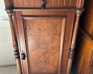 music cabinet with damage to front corner