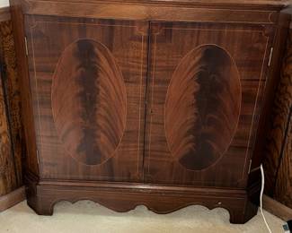Detail of flame mahogany in corner cabinet 