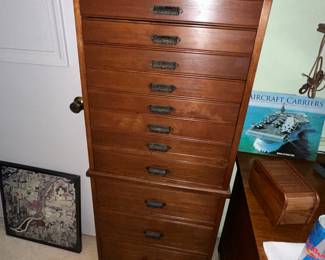 This is a fun tall antique drawer cabinet 