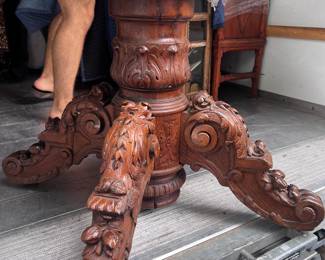 Carved base oval table