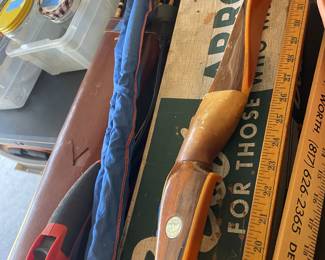 Vintage Bow and Arrows and a vintage fly fishing rod