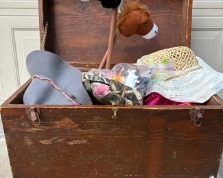 wooden trunk full of improve costume props