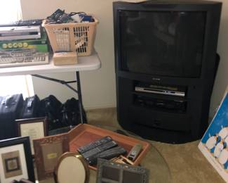 Picture Frames, TV with built in sound system, coffee table, electronics