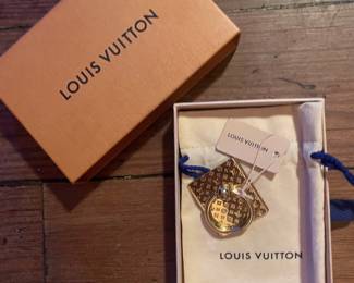 GOLD TONED BRASS LOUIS VUITTION NANOGRAM PHONE HOLDER 