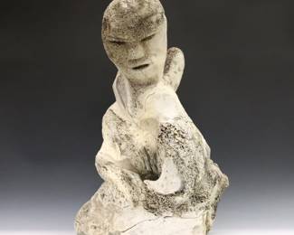 A large 20th century Inuit carved Whale bone figure of a mother and two children from the Naujaat (Repulse Bay) hamlet, Kivalliq Region, Canada. Includes the original 1971 purchase receipt from "Innuit Gallery of Eskimo Art" in Toronto, and a customs certificate from "Eskimo Fine Arts" in Ottawa both citing the artist as "Evaluarjuk", possibly Henry Evaluardjuk (Inuit, Igloolik, 1923-2007). Partially legible signature in syllabics at front of base. Cracks throughout, damage to portion of bottom edge. Approx. 15 x 11 x 22 1/2" high overall. ESTIMATE $800-1,200
